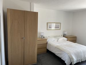 Photo showing part of main bedroom